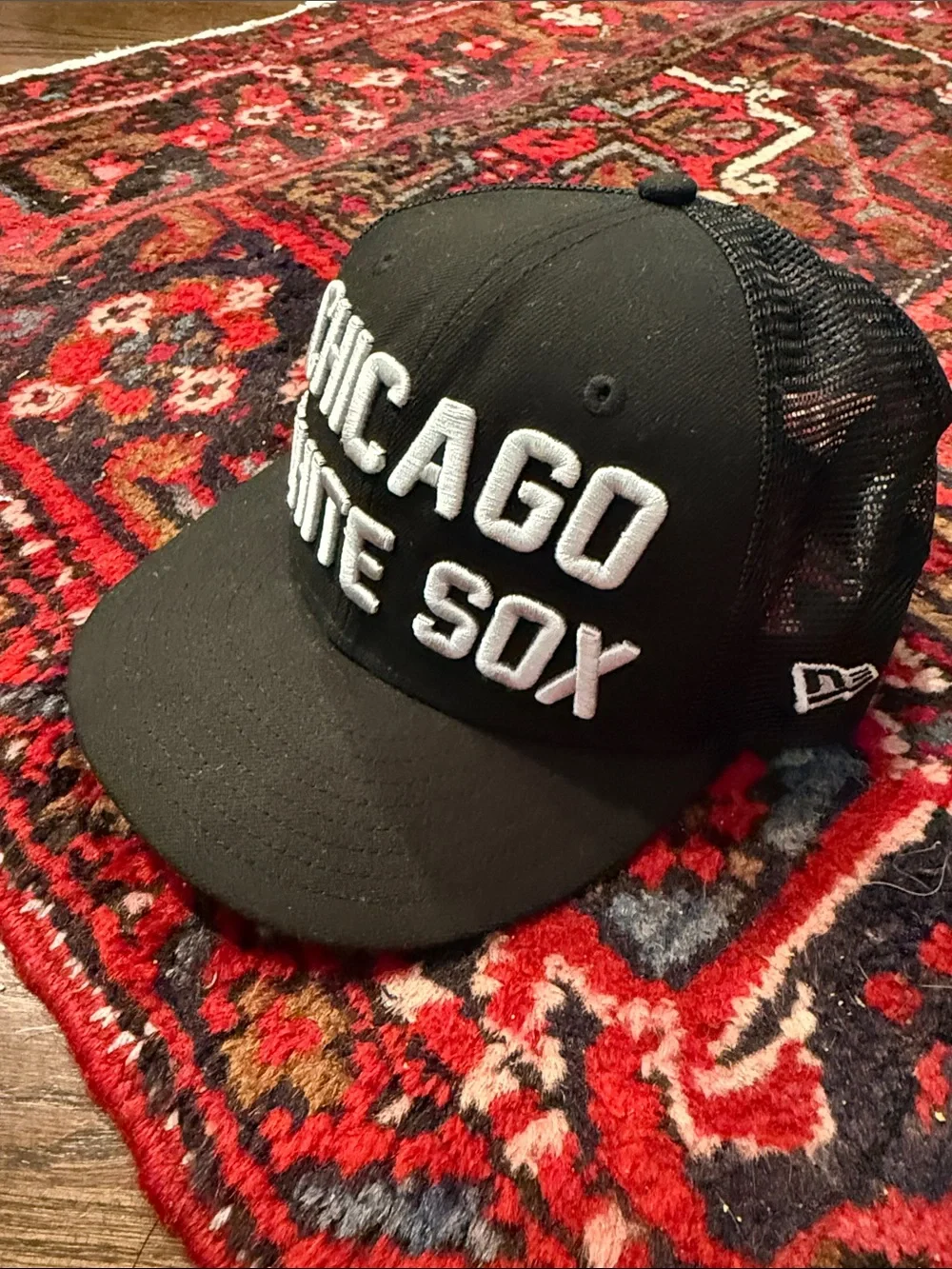 New Era Black Chicago White Sox Mesh Trucker Hat with White Embroidered Logo